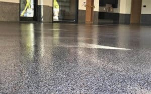 Glossy porch concrete floor coated with epoxy coating system.